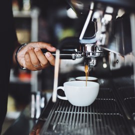 Close Up Of Hand Holding Coffee Cup 302902