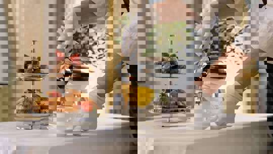 Pouring Drink On Dining Table