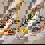 Pouring Drink On Dining Table