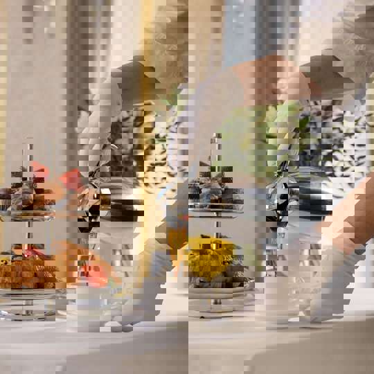 Pouring Drink On Dining Table