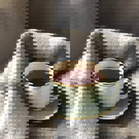 Coffee In Mug In Grey Blanket