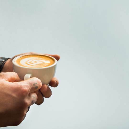 Man holding cup of coffee