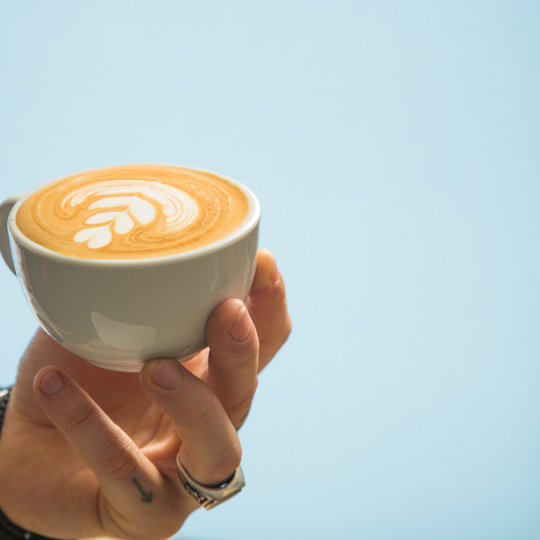 Mug of coffee in hand